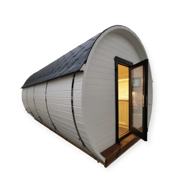 Camping Barrel 3.0 x 5.9 m with wooden finish, glass door, and shingle roof, perfect for cozy outdoor experiences.