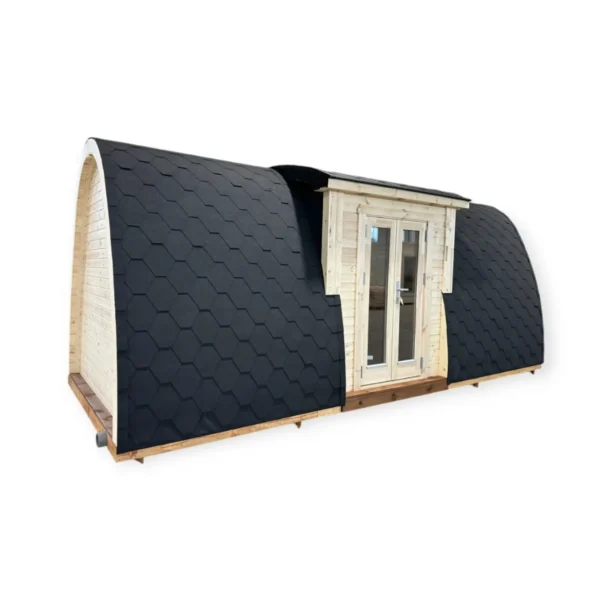 Insulated camping pod with black shingle roof, double glass doors, and spacious design, ideal for year-round outdoor use.