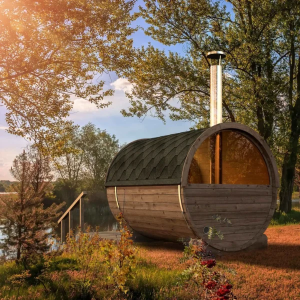 Compact Ehala 250 Barrel Sauna for 4 people with outdoor seating, crafted from premium Nordic spruce with tempered glass windows.