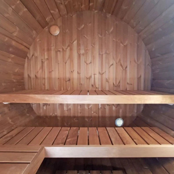 Compact thermowood barrel sauna with terrace, perfect for 2-3 people