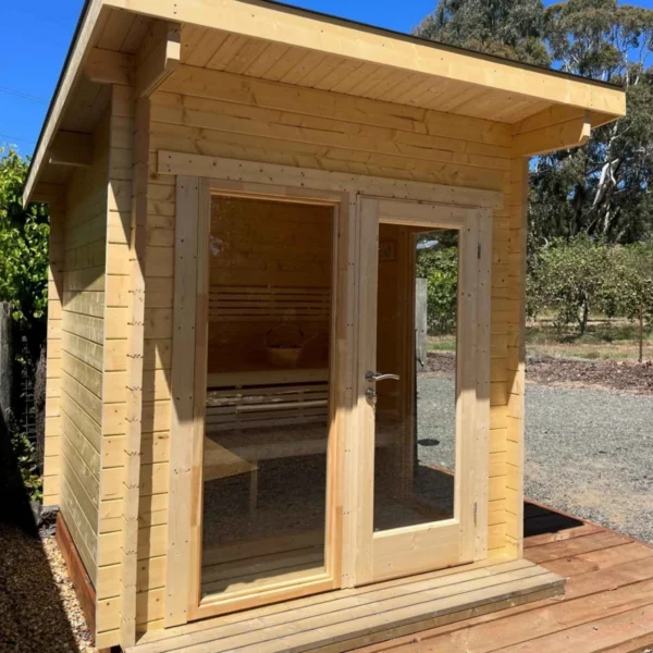 Mielikki sauna, compact and stylish, measuring 2.29 x 2.47 m. Crafted from spruce, featuring tempered glass windows and premium aspen benches for a cozy sauna experience.