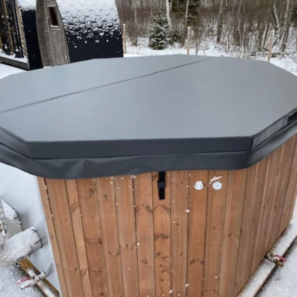 The "BubbleKing XXL" hot tub provides a spacious and luxurious relaxation experience for up to 10 people. It features an ergonomic octagonal fiberglass insert (available in Gray, Blue, or White), durable thermowood walls, and an integrated stainless steel heater (30kW) with a 2-meter chimney. With its 2400-liter capacity, it's perfect for gatherings or quiet evenings. Optional LED lighting, air bubble system, and Bluetooth speakers enhance the experience further.