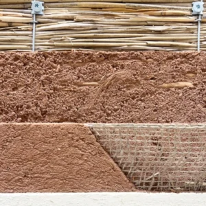 Reed panels are coated with hempclay plaster, jute mesh, clay rustic finishing plaster, and decorative clay plaster with flax fibers.