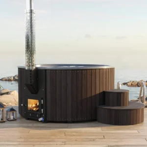 Yoshino Kumano hot tub with dark exterior and dark gray fiberglass interior, visible ergonomic seats, marine aluminum heater and wooden deck with sea view, modern and practical design.